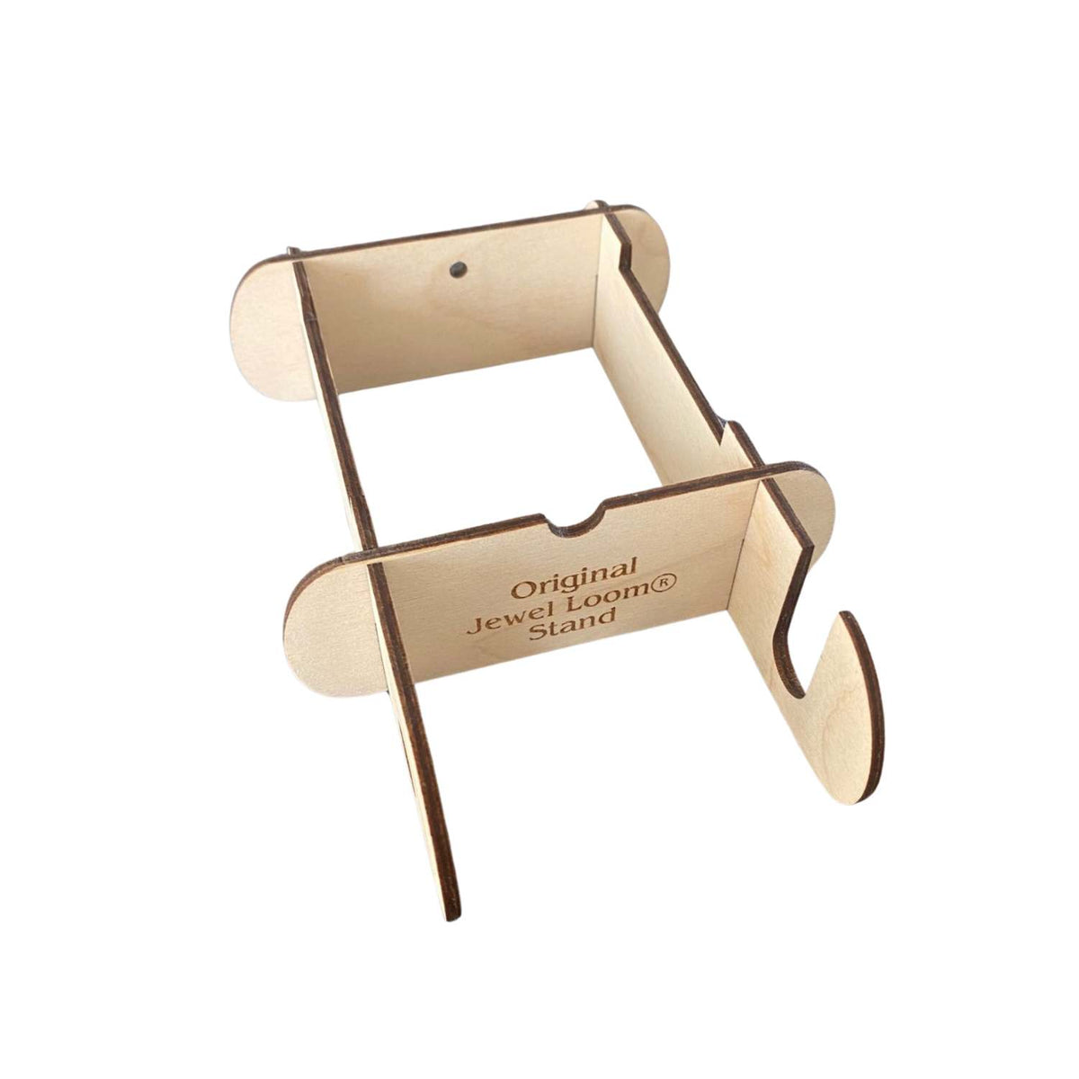 A beige wooden stand designed for holding the Jewel Loom bead loom, with the text 'Original Jewel Loom' printed on the side. Photographed on a white background