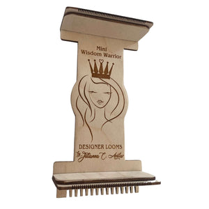 A wooden mini bead loom with a design featuring a woman's face at the top and the text 'Mini Wisdom Warrior' along with the brand name 'Jewel Loom'.