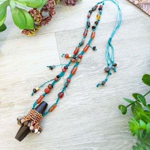 Beaded Necklace made with earth tone colors and a large button along with teal Beadalon B-Lon threads
