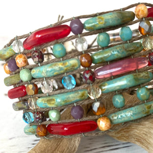 Multi-strand wrap bracelet with turquoise, red, and amber Czech glass beads on waxed cord, woven on the Beadalon Jewel Loom by Julianna C. Avelar