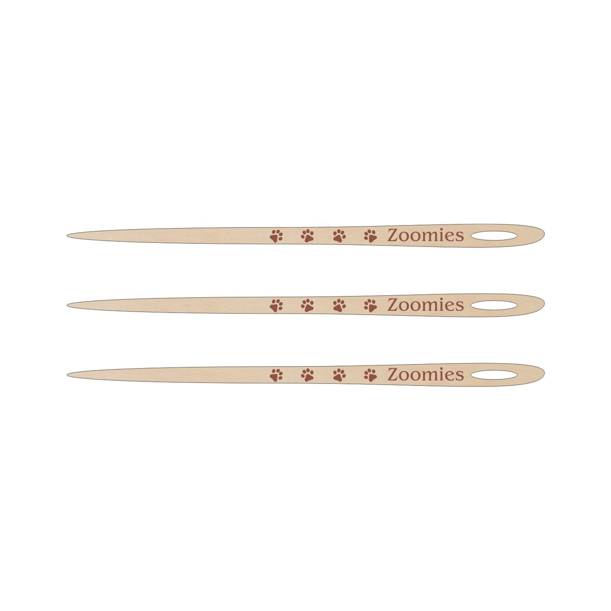 Three wooden knitting needles with the word &#39;Zoomies&#39; printed on them, arranged horizontally.
