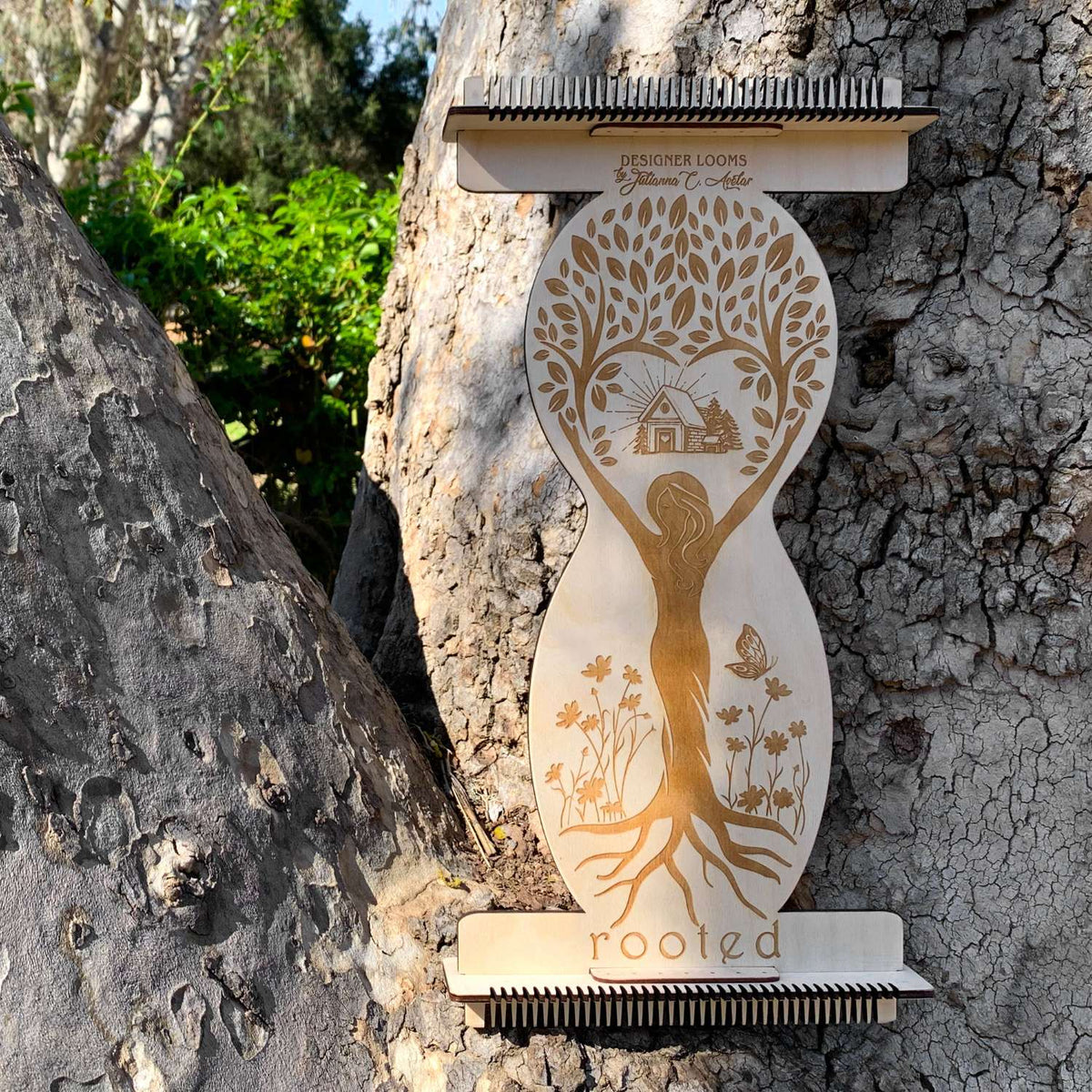 ROOTED Loom displayed sitting on a tree knob located on an old tree. This is what I would refer to as a decorative shot of the product. 