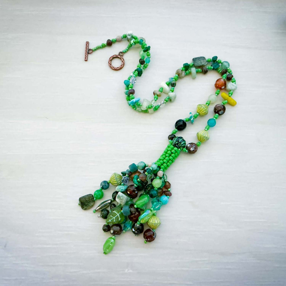 Jewel Loom Jewel Box March 2026 Jewelry Project featuring a Colorful beaded necklace on a light gray background